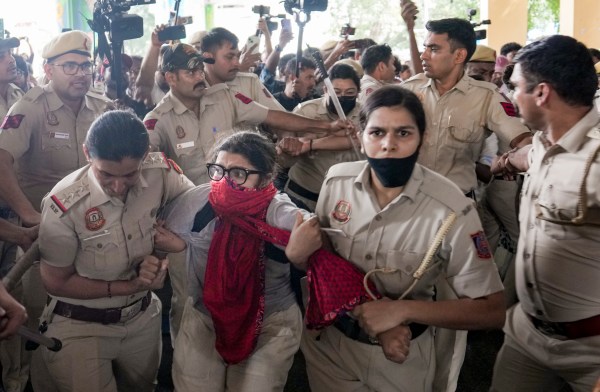 New Delhi: Police personnel detain protestors amid continued demonstration calls by the Cockroach Janta Party (CJP) demanding the resignation of Chief Election Commissioner (CEC) Gyanesh Kumar, in the RK Ashram area, New Delhi, Sunday, Oct. 11, 2026. (PTI Photo/Salman Ali)(PTI10_11_2026_000251B)