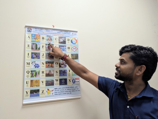 A colourful classroom chart begins with A for Alert, B for Bunker and C for Cyclone, and introduces terms such as evacuation, mitigation, search and rescue, and tsunami early warning systems.