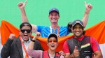 India trap shooting coach Peter Wilson (C) with gold medallist Neeru Dhanda and Kynan Chenai. (PTI)