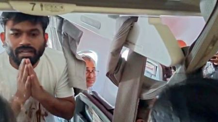 Cockroach Janta Party (CJP) Founder Abhijeet Dipke detain by the Police after the flight landed at IGI Airport, in New Delhi on Saturday. (ANI Video Grab)