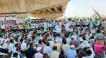 Swabhimani Shetkari Sanghatana activists and farmers led by Raju Shetti gather on Thursday under heavy police presence. (Express Photo)