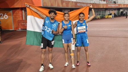 Champion Simran Sharma with her guide Shivam and bronze medallist Tejalben Damor in Women's 200m T12. (SAI Media)