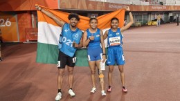 Champion Simran Sharma with her guide Shivam and bronze medallist Tejalben Damor in Women's 200m T12. (SAI Media)