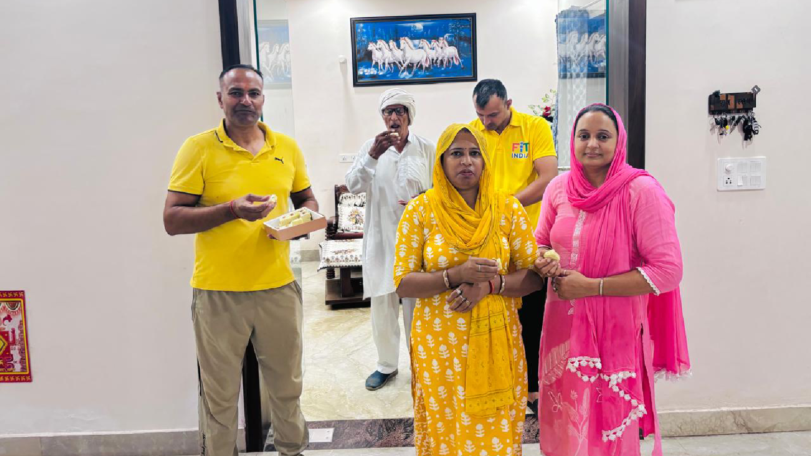 Nitesh Siwach’s family celebrates at their Panipat home. Special Arrangement