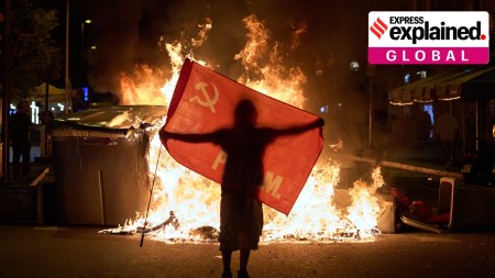 A protester at a demonstration over Spain's housing crisis, hours after PM Pedro Sánchez announced an early general election, in Barcelona, Spain, Oct. 5. (AP Photo/Emilio Morenatti)