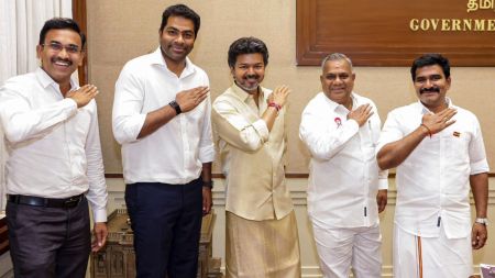 Tamil Nadu Chief Minister and TVK chief C Joseph Vijay, centre, along with Arunraj KG, left, and other party leaders during a meeting following the Secular Social Justice Victory Alliance's win in the Dharapuram and Maduranthakam assembly by-elections, in Chennai. (PTI Photo)