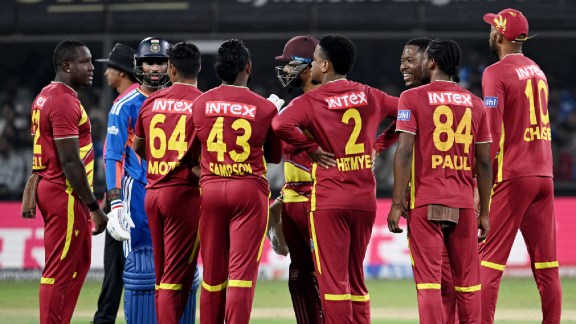 West Indies players wait for the third umpire's decision on the run-out of India's Tilak Varma during the 3rd T20I at Holkar Stadium, in Indore on Sunday. (ANI Photo)