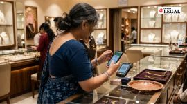 UPI Transaction merchant QR code woman jewellery showroom consumer news QR code