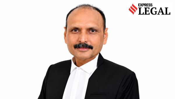 Justice P M Raval Gujarat High Court buddha image saree FIR