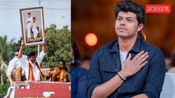 CM Vijay holding up a framed photograph of his son Jason Sanjay from Sigma during his Madhurandhagam roadshow