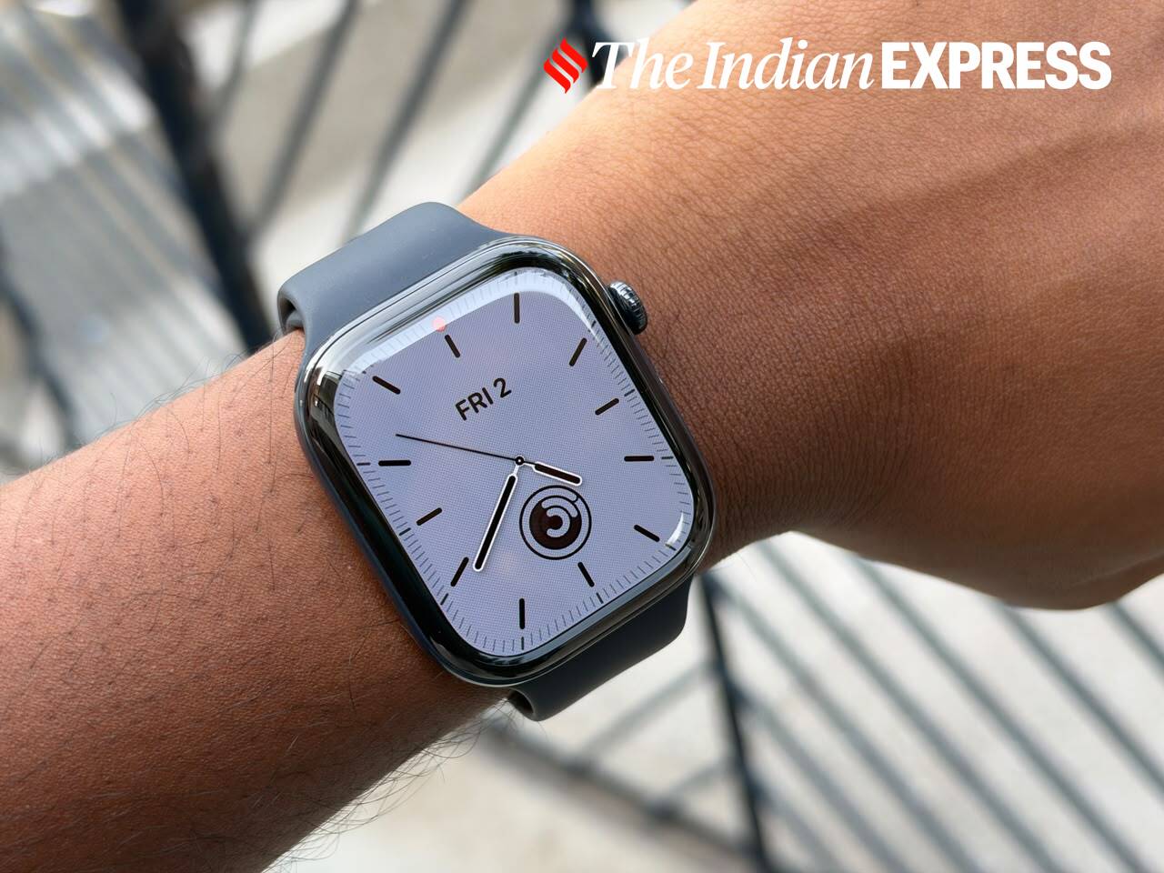 The polished ceramic Apple Watch Series 12 paired with a navy blue Sport Band offers a premium look on the wrist.