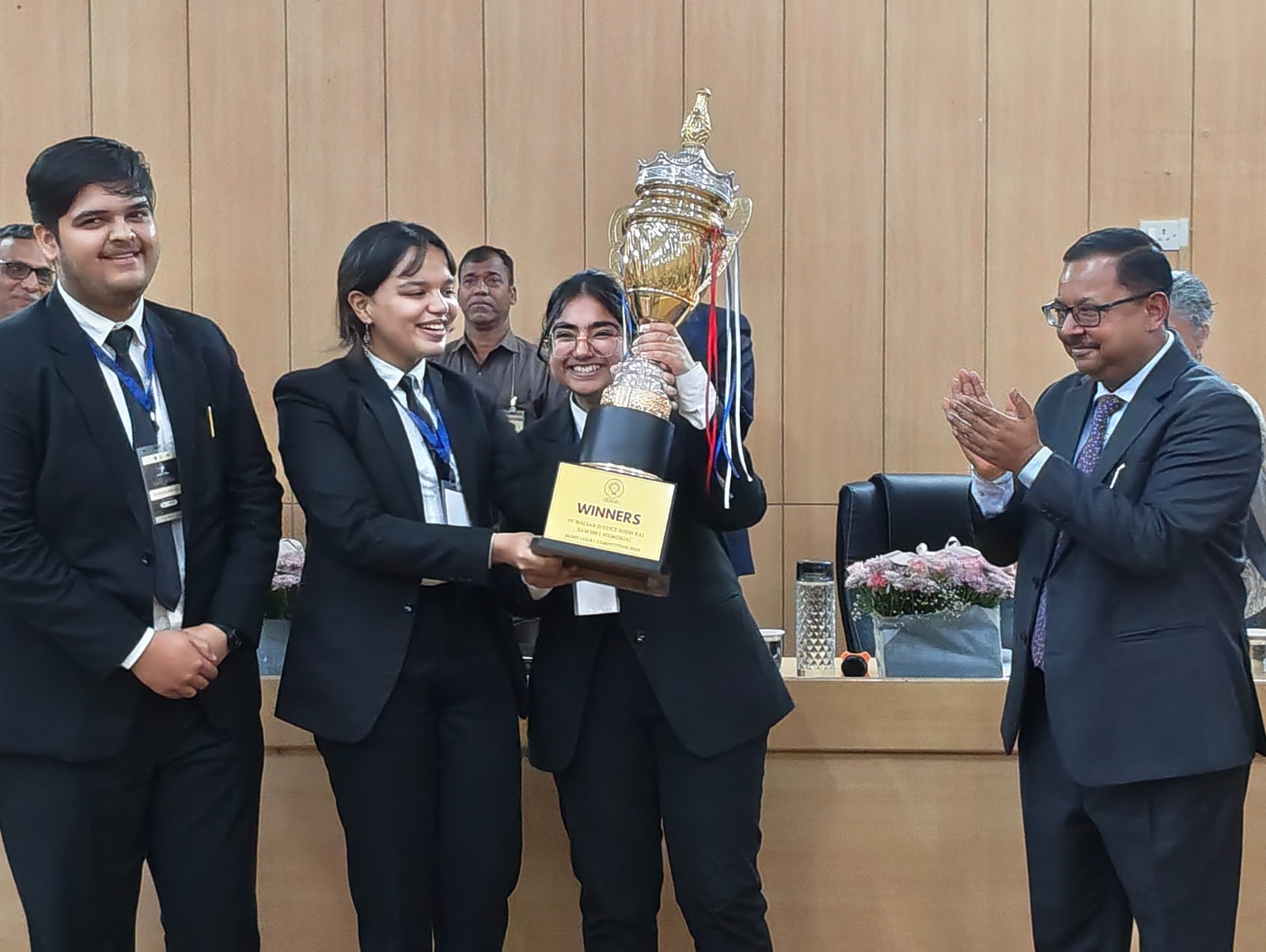 Justice Bhuyan with winners of the Moot Court competition