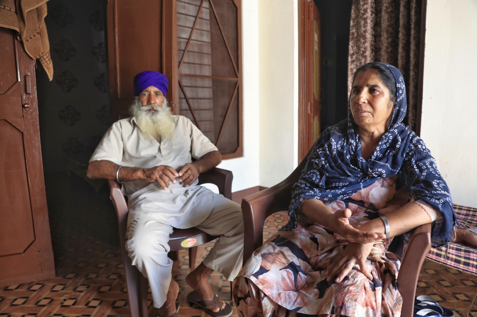 Jasbir Singh and Baljit Kaur at their home in Bagrian, Kapurthala. Their son Sukhraj is now in Spain.