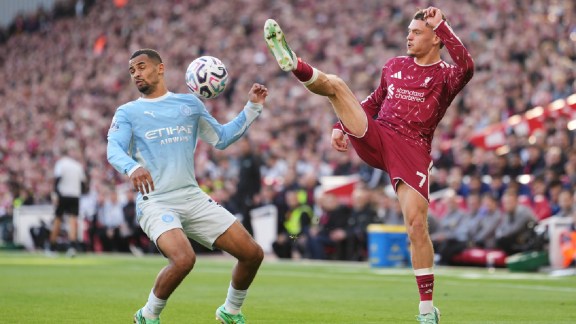 Manchester City's Iliman Ndiaye, left, challenges for the ball with Liverpool's Florian Wirtz during the English Premier League soccer match between Liverpool and Manchester City in Liverpool, England, Sunday, Oct. 11, 2026. (AP Photo/Jon Super)