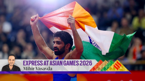 India's Aman Sehrawat celebrates with the Indian flag after winning the men's freestyle 57kg gold medal bout. (Photo: REUTERS)