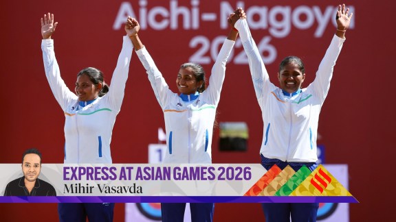 India's Kumkum Anil Mohod, Ankita Bhakat and Kirti celebrate on the podium during the medal ceremony after winning gold. (Reuters Photo)