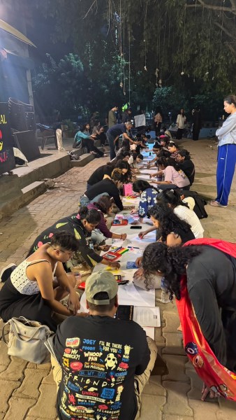 At C-9 Market, the women spread long sheets of paper across the pavement and began drawing. (Express Photo by Sophiya Mathew)