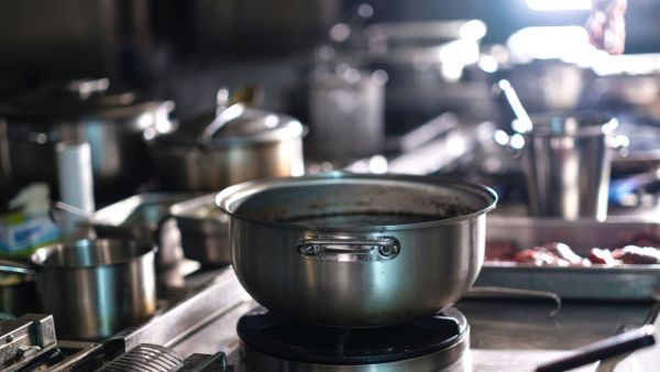 Iron kadhais, stainless steel pots and non-stick pans interact with food differently, making cookware choice an important consideration for safe cooking.