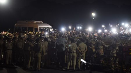 Heavy security personnel deployed behind barricades near Vijay Chowk in Delhi. (ANI Photo)