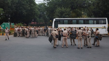 Security personnel stand near the site of a Cockroach Janta Party (CJP) protest seeking the resignation of India's Chief Election Commissioner, Gyanesh Kumar, in New Delhi