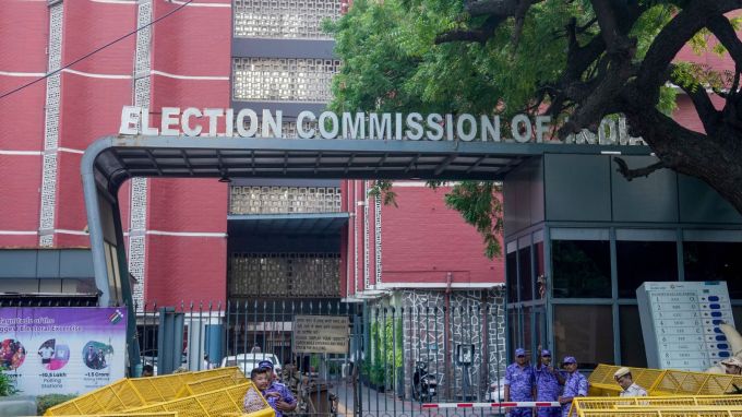 Security personnel stand guard behind police barricades outside the Election Commission of India (ECI) headquarters (PTI Photo)