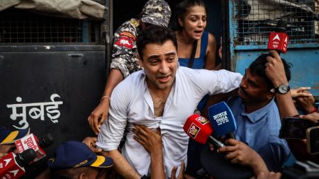 Imran Khan being detained by the Mumbai Police at the protest site. (Express Photo)
