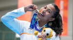 Lovlina Borgohain poses for photographers during the medal ceremony for the women's 75kg boxing event at the 20th Asian Games, in Nishio, Aichi, Japan, Friday, Oct. 2, 2026. (PTI Photo)