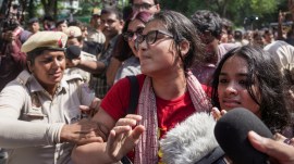 All India Students' Association (AISA) National President Neha Bora being detained during a protest at Jantar Mantar.