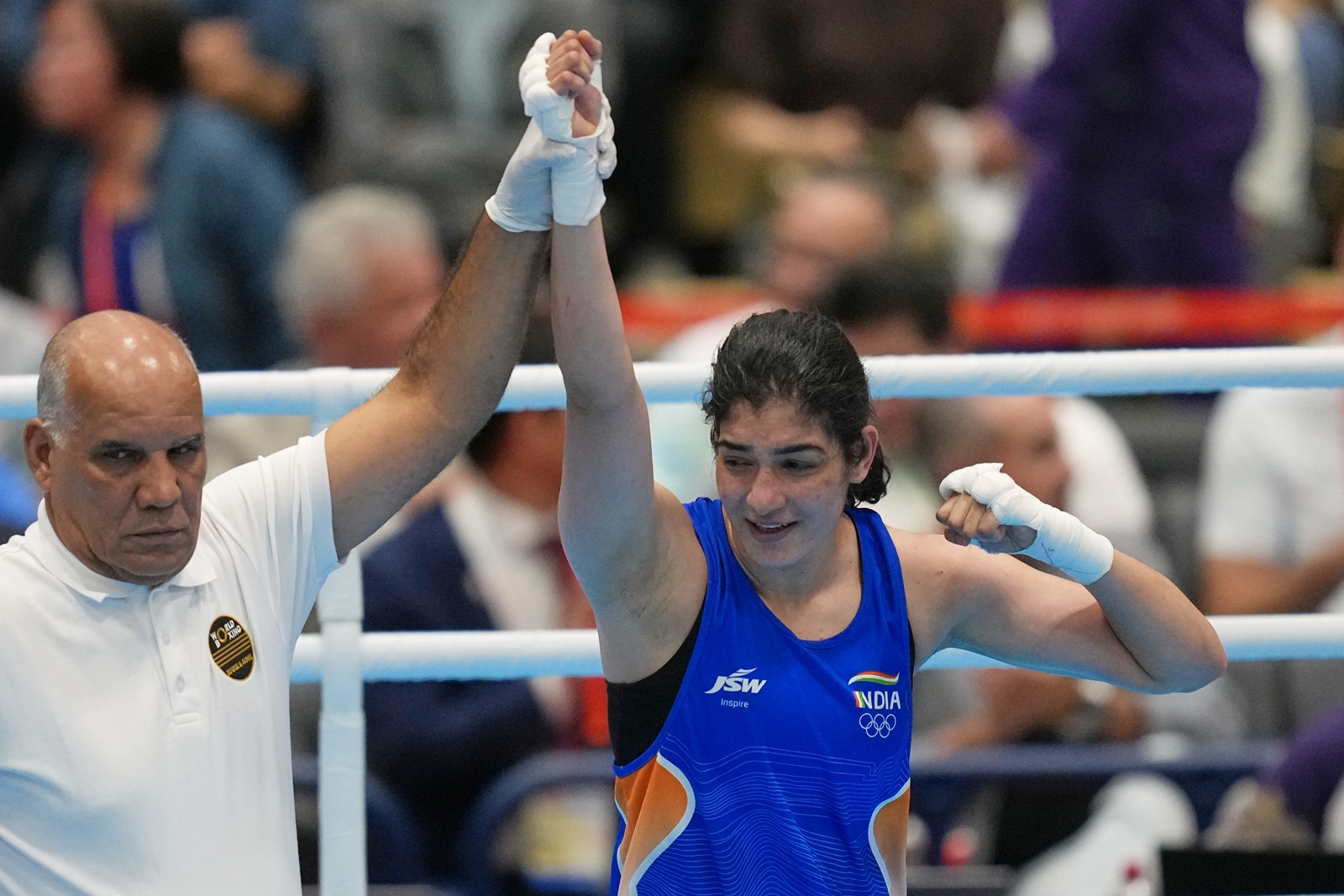 Parveen celebrates her win by decision over Taiwan's Chen Nien-chin, in their women's 65kg boxing final match at the Asian Games in Nishio, Aichi prefecture, Japan, Friday, Oct. 2, 2026. (AP Photo)