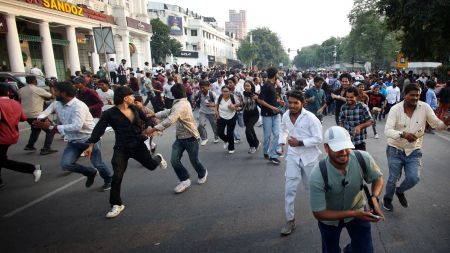 Policemen detained Cockroach Janta Party supporters during a demonstration demanding the resignation of the Election Commissioner Gyanesh Kumar at Connaught Place in New Delhi on Saturday
