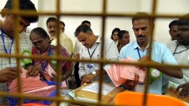 By-Election Results 2026: Polling officials at work during the counting of votes for the Dharapuram Assembly by-election, in Tiruppur district, Tamil Nadu