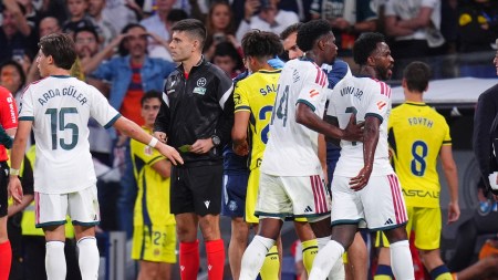 Real Madrid's Vinicius Junior, right, leaves the pitch after being shown a red card during the La Liga soccer match between Real Madrid and Villarreal in Madrid, Spain, Saturday, Oct. 10, 2026. (AP Photo/Manu Fernandez)